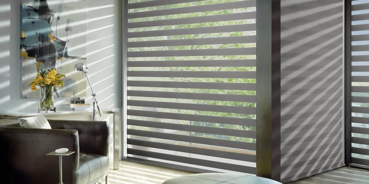 Hunter Douglas Designer Banded Shades filtering light into a sunroom near Bellevue, WA, during the day